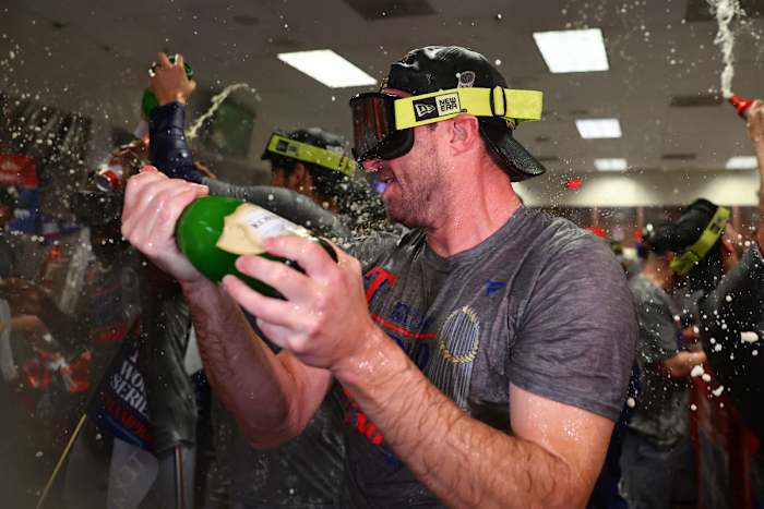 Nov 1, 2023; Phoenix, Arizona, USA; Texas Rangers starting pitcher Max Scherzer (31) celebrates in the locker room after winning the 2023 World Series in five games against the Arizona Diamondbacks at Chase Field. Mandatory Credit: Mark J. Rebilas-USA TODAY Sports